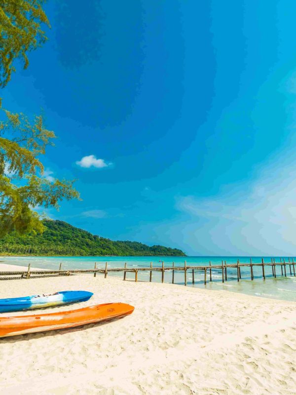Beautiful nature tropical beach and sea with kayak boat and coconut palm tree on paradise island for travel vacation